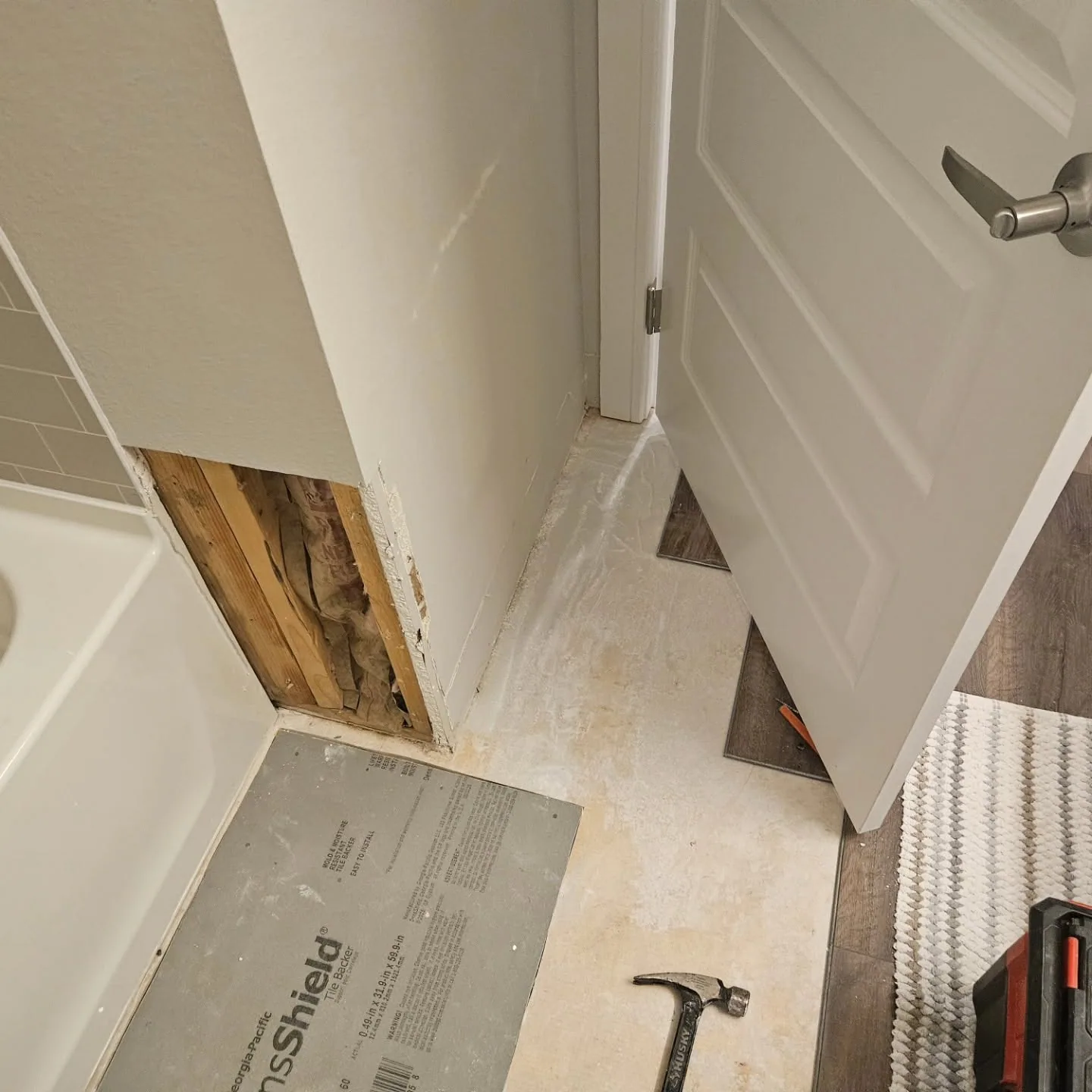 Bathroom drywall cutout exposed studs tile backer board