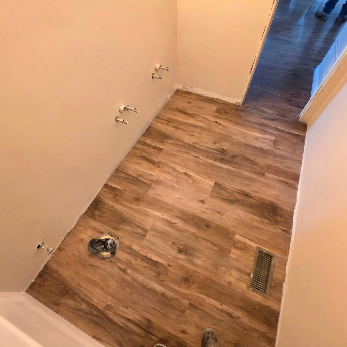 Bathroom vinyl plank floor toilet flange supply valves