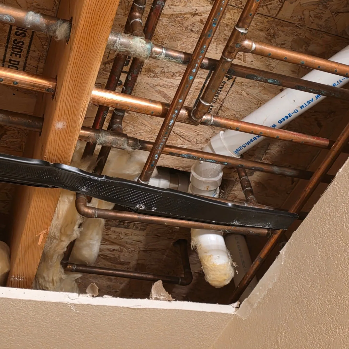 Copper water lines pvc drain open drywall ceiling